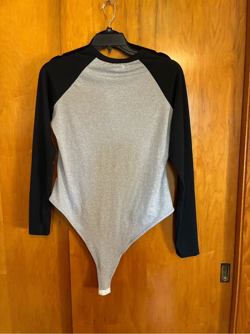Long Sleeve Raglan One-Piece Bodysuit in Silver and Black never worn